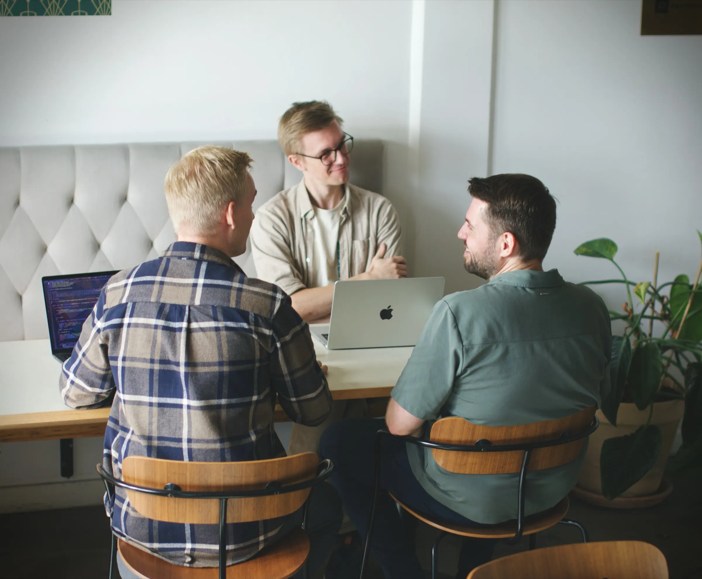 The founders talking around the office table